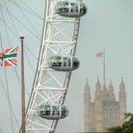 Photo: Flags, a wheel and a tower