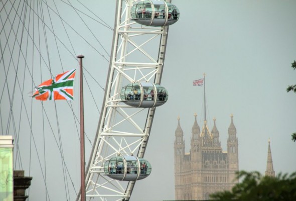Photo: Flags, a wheel and a tower